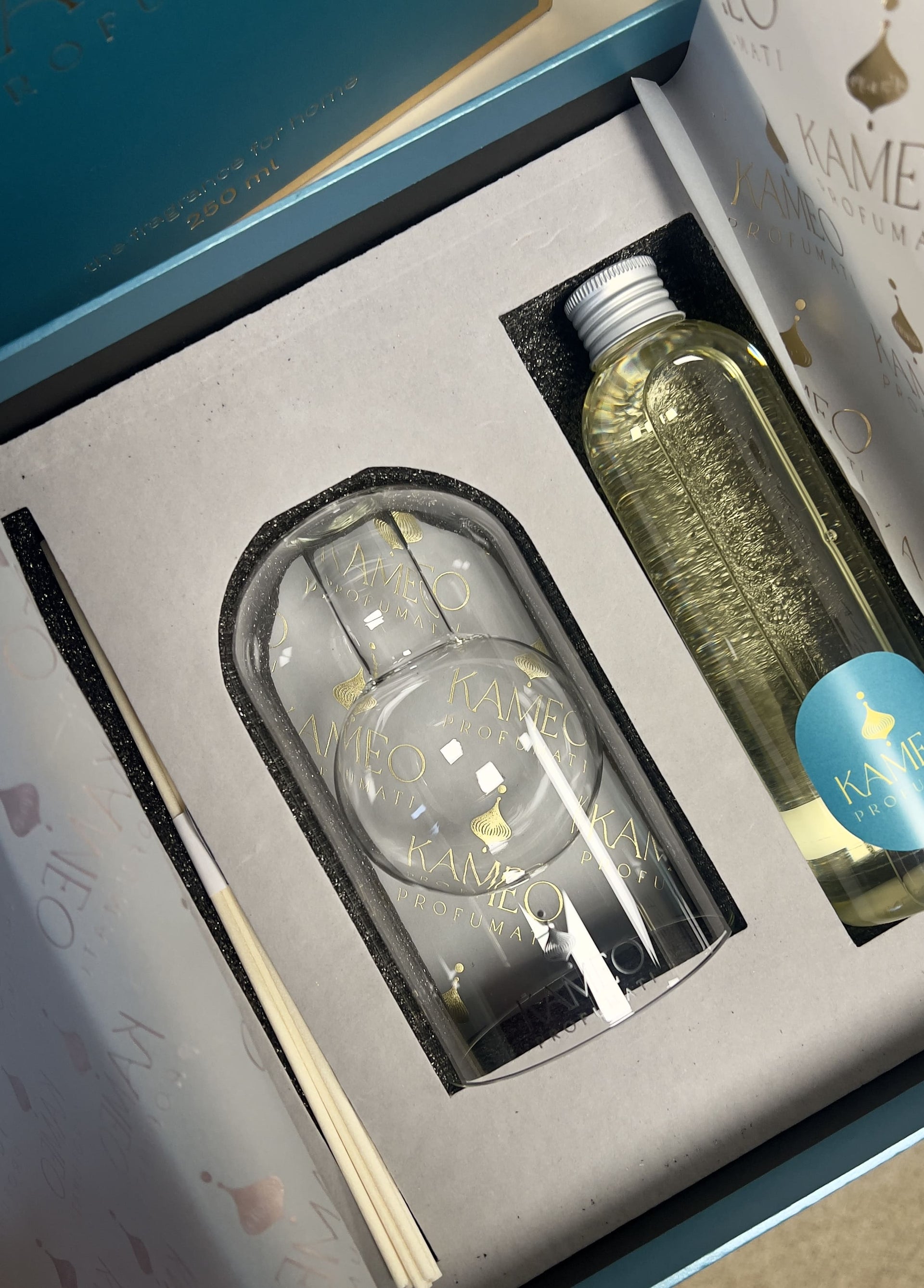 Gift set with a bottle and glasses in a box, featuring Kameko branding.