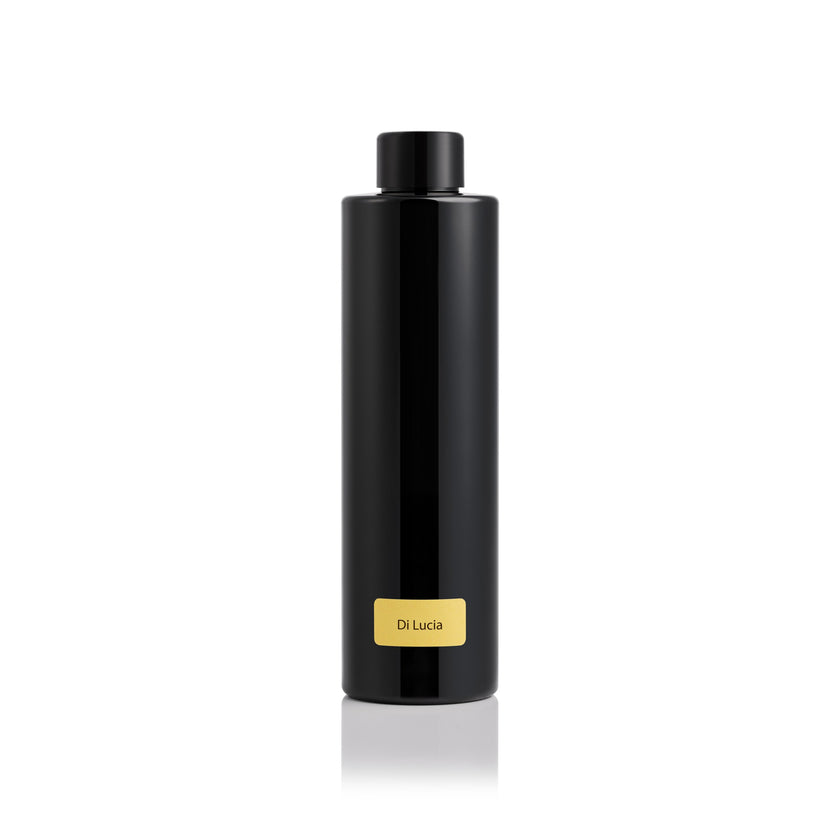 Black cylindrical product with a gold label on a white background